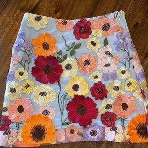 Beautifully detailed flower skirt to accompany the flowers you can buy yourself.